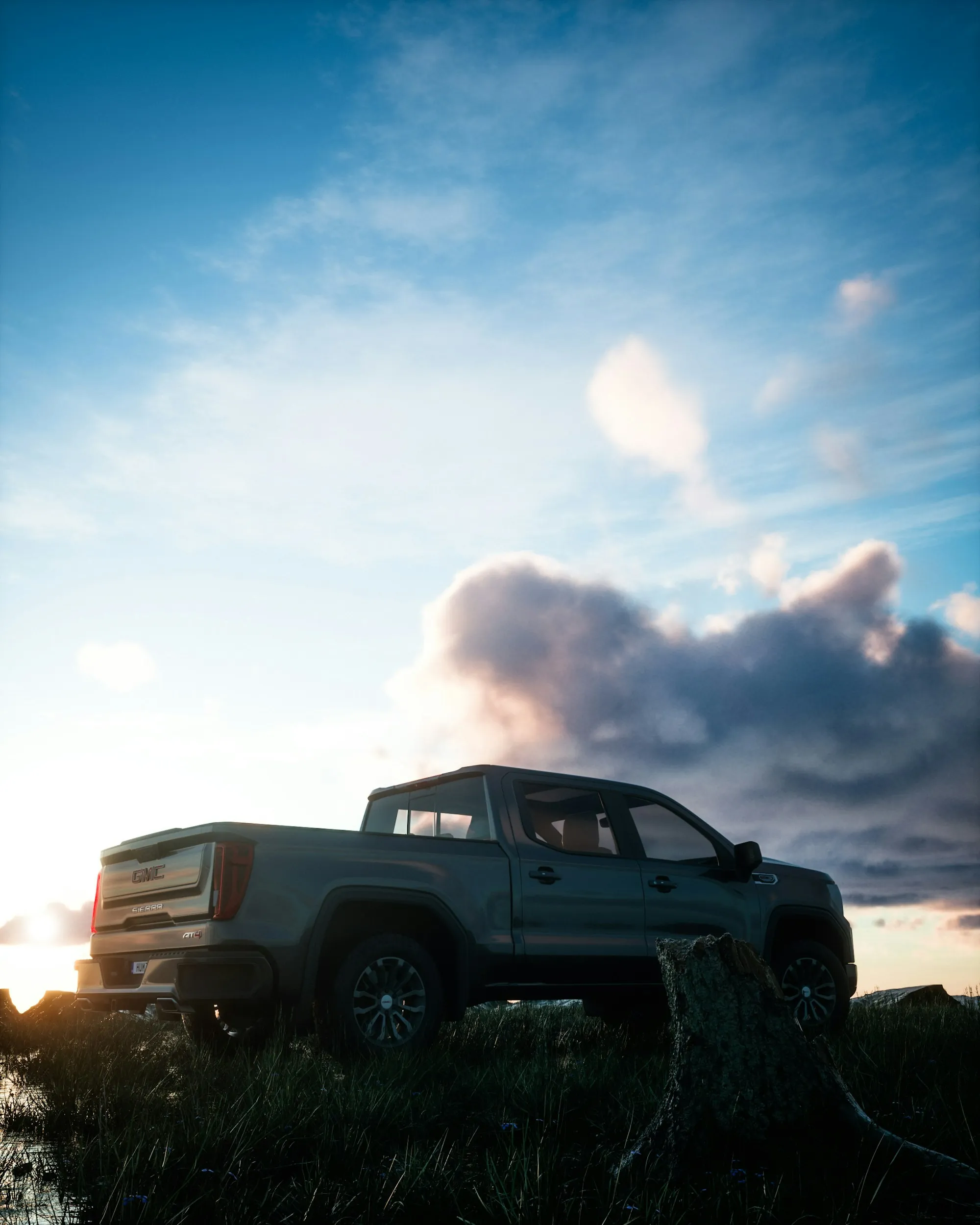 Pickup truck parked on a ridge under a blue sky