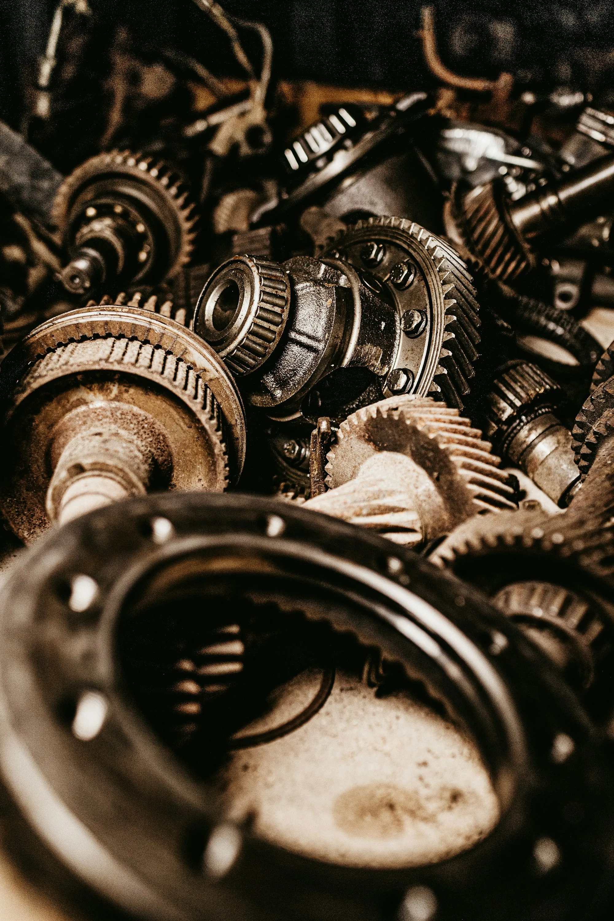 Disassembled transmission gears laid out in a workshop